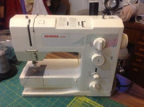 Most work is tackled on the Bernina 1008. Purchased used in 2001 with less than one year of use on it. I love the versatility of specialty presser feet by Bernina, and the very high stitch quality of this workhorse never fails.