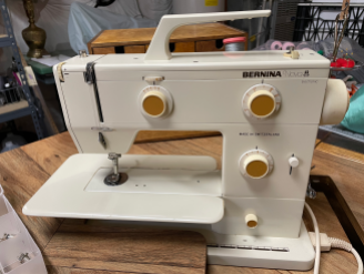 The Bernina Nova 900, Found for $24 USD at an ARC thrift store with the original case, all presser feet attachments, an extension table, embroidery hoop, bobbins, and tools. Another miraculous find! After an $80 repair to the stitch selection button (which was internally cracked), it works as well as my Bernina 1008. Most unexpectedly, someone at my daughter's place of employment was giving away a table that ONLY fits the Nova machine. Apparently, it was meant to be with me!